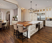 Large island featuring farmhouse sink