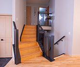 New stair railing stained to match island cabintes