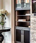 Cabinet doors with speaker mesh to hide audio visual equipment