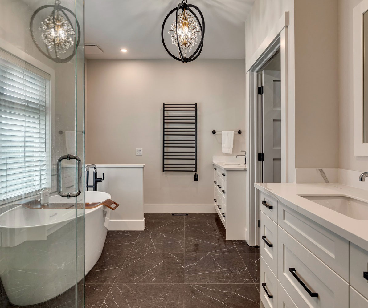 New freestanding bath tub, vanity cabinets, hidden WC and wall mounted heated towel rack