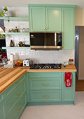 Wall between kitchen and dining room is removed to provide an open plan design
